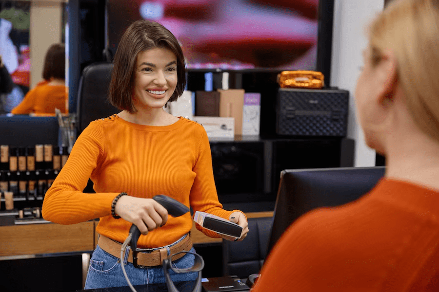 A woman happily using a barcode scanner. | Condor PH