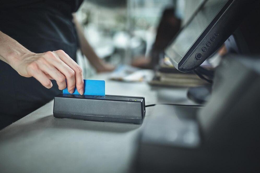 A Person Using A Card Reader | Condor PH