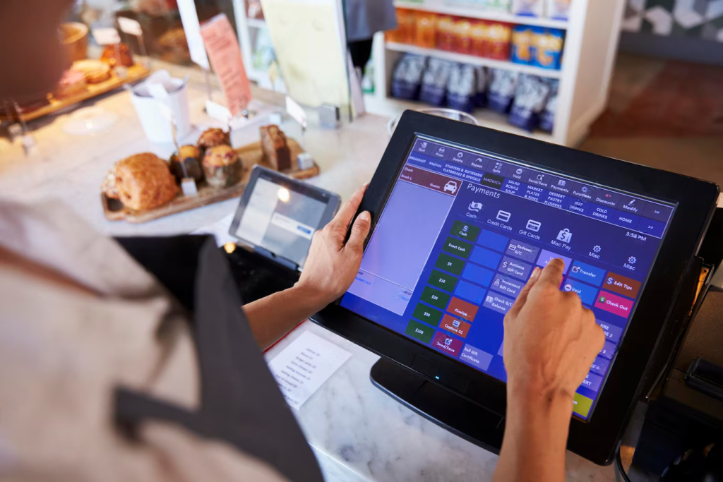 A Hand Interacting With A Touchscreen Pos System | Condor PH