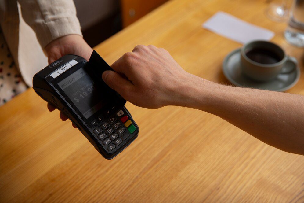 A Customer Is Swiping Their Card At A Pos Terminal | Condor PH
