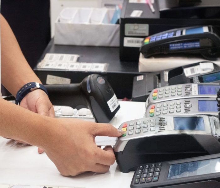 A Person Using A POS System In A Department Store | Condor PH