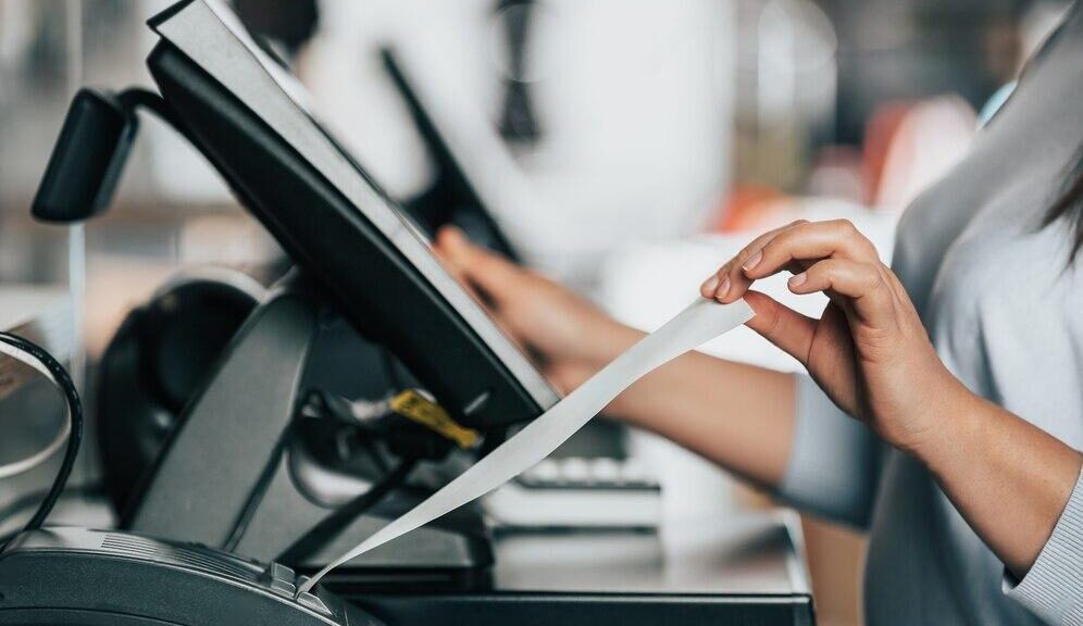 A Cashier’s Hand Holding The Receipt | Condor PH A Cashier’s Hand Holding The Receipt | Condor PH