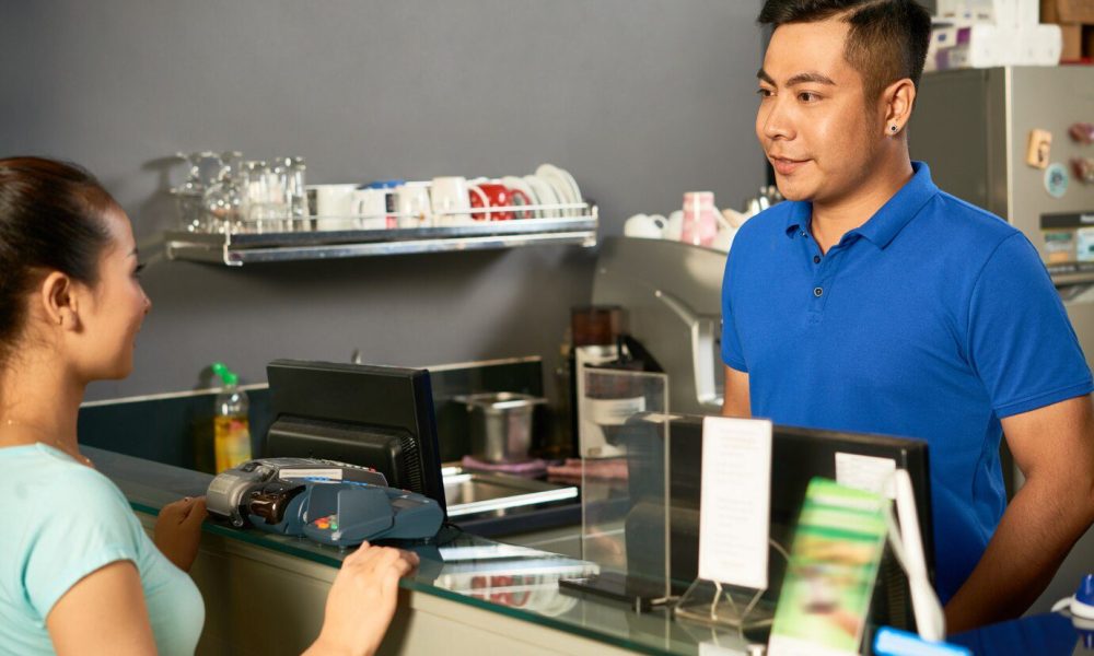 A Female Customer Is Placing Her Order At The Cashier | Condor PH