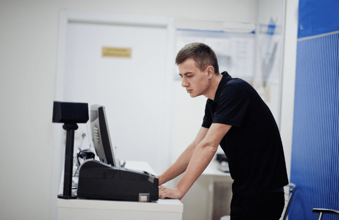 A Man In Front Of POS Machine | Condor PH