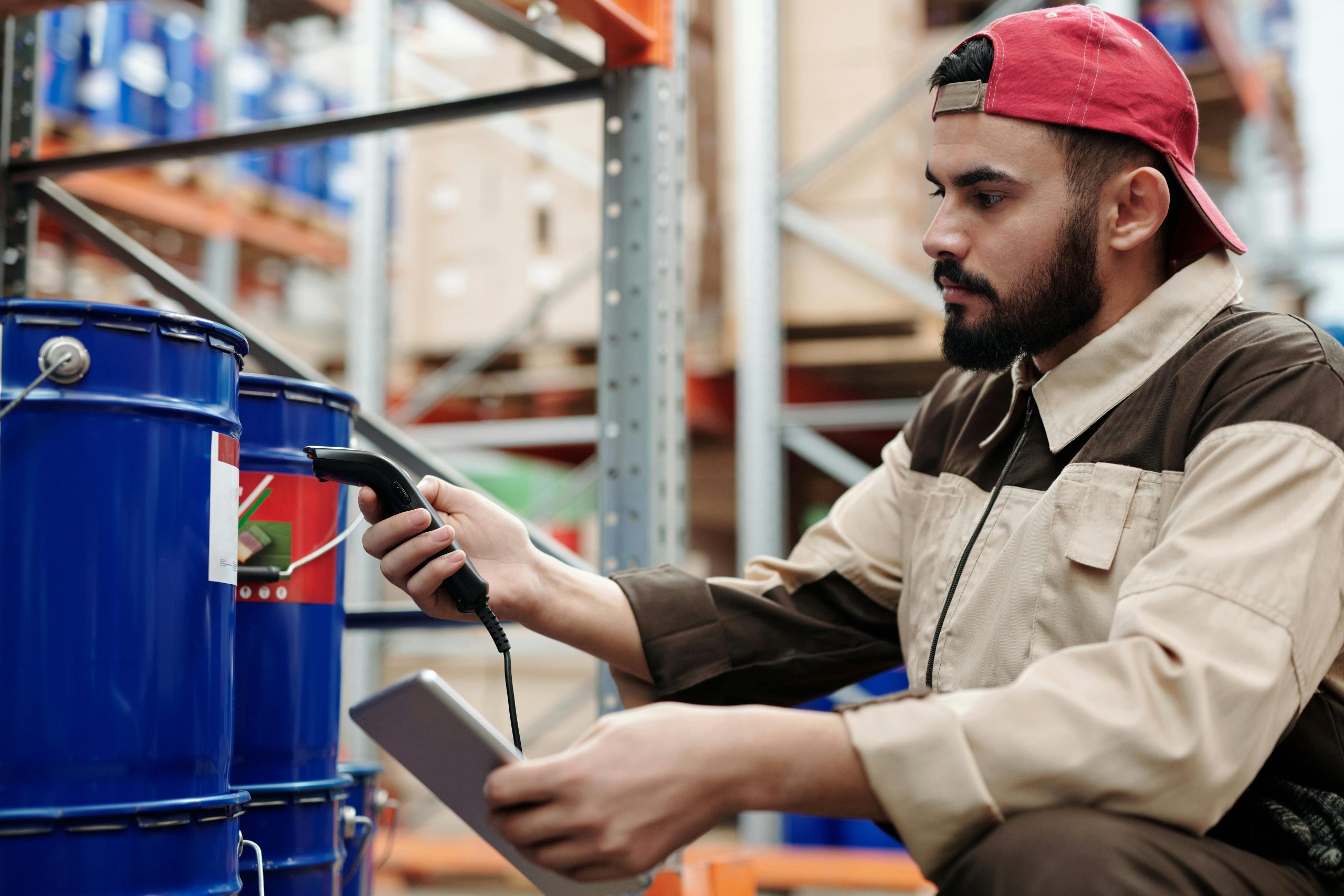 Logistics Staff Using a Wired Barcode Scanner to Track Products in a Warehouse | Condor PH Logistics Staff Using a Wired Barcode Scanner to Track Products in a Warehouse | Condor PH