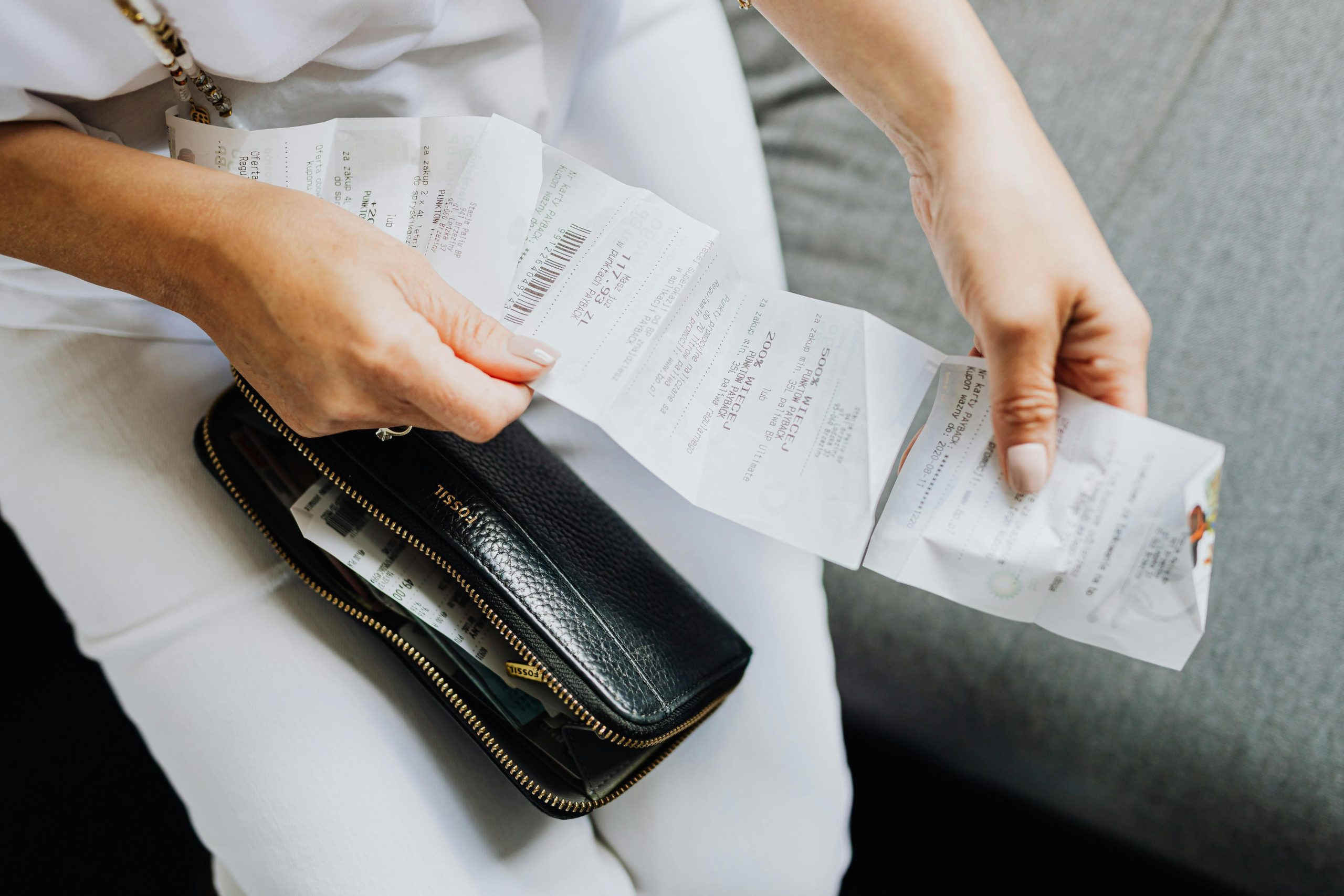 A Person Holding a receipt paper | Condor PH A Person Holding a receipt paper | Condor PH