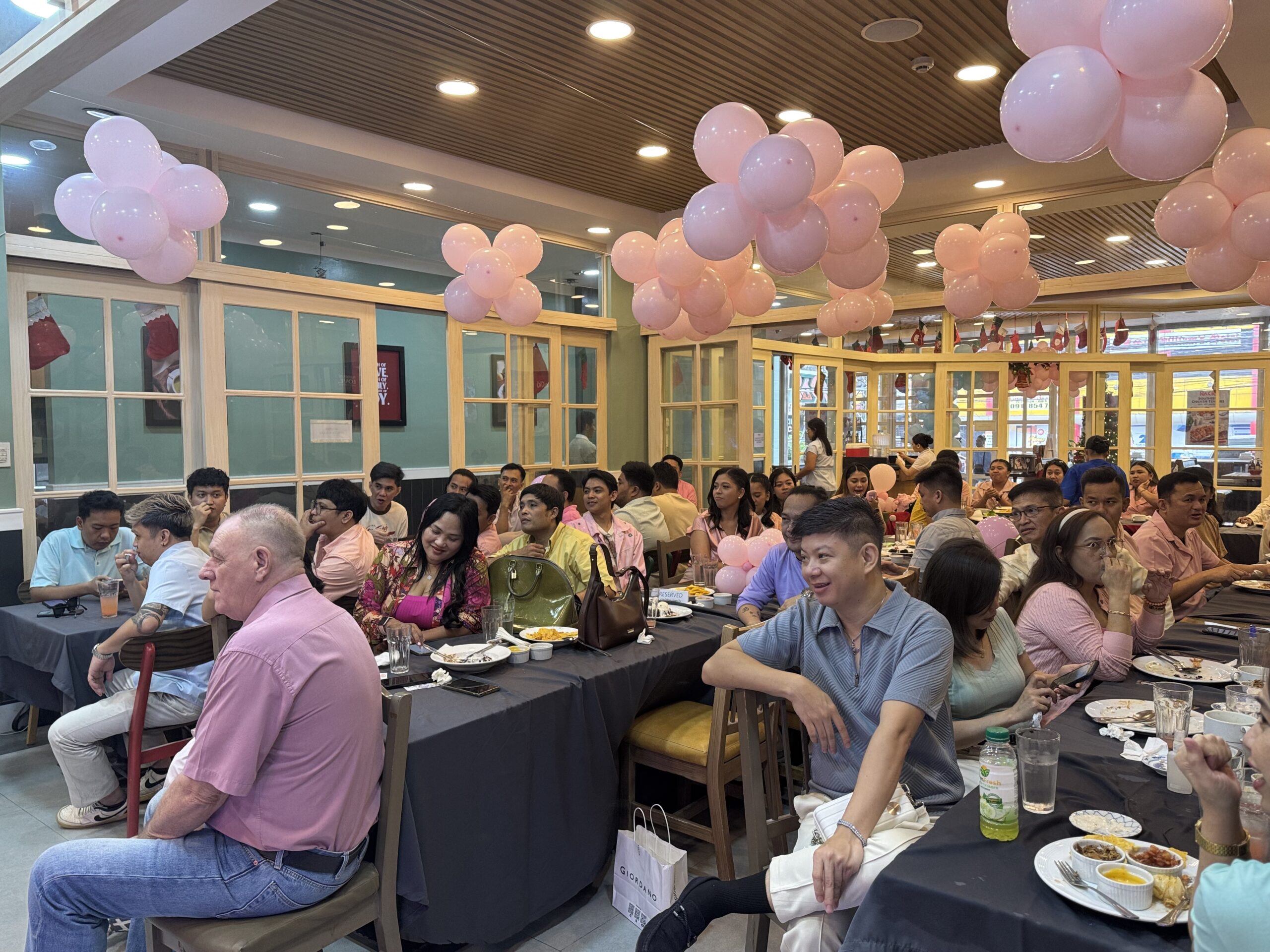 A Pastel-Themed Milestone - A Group Of People Seated At Tables | Condor PH