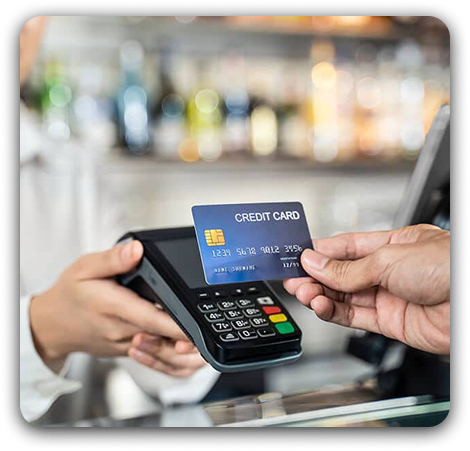 Customer-at-the-checkout-paying-with-credit-card-on-the-payment-terminal 1